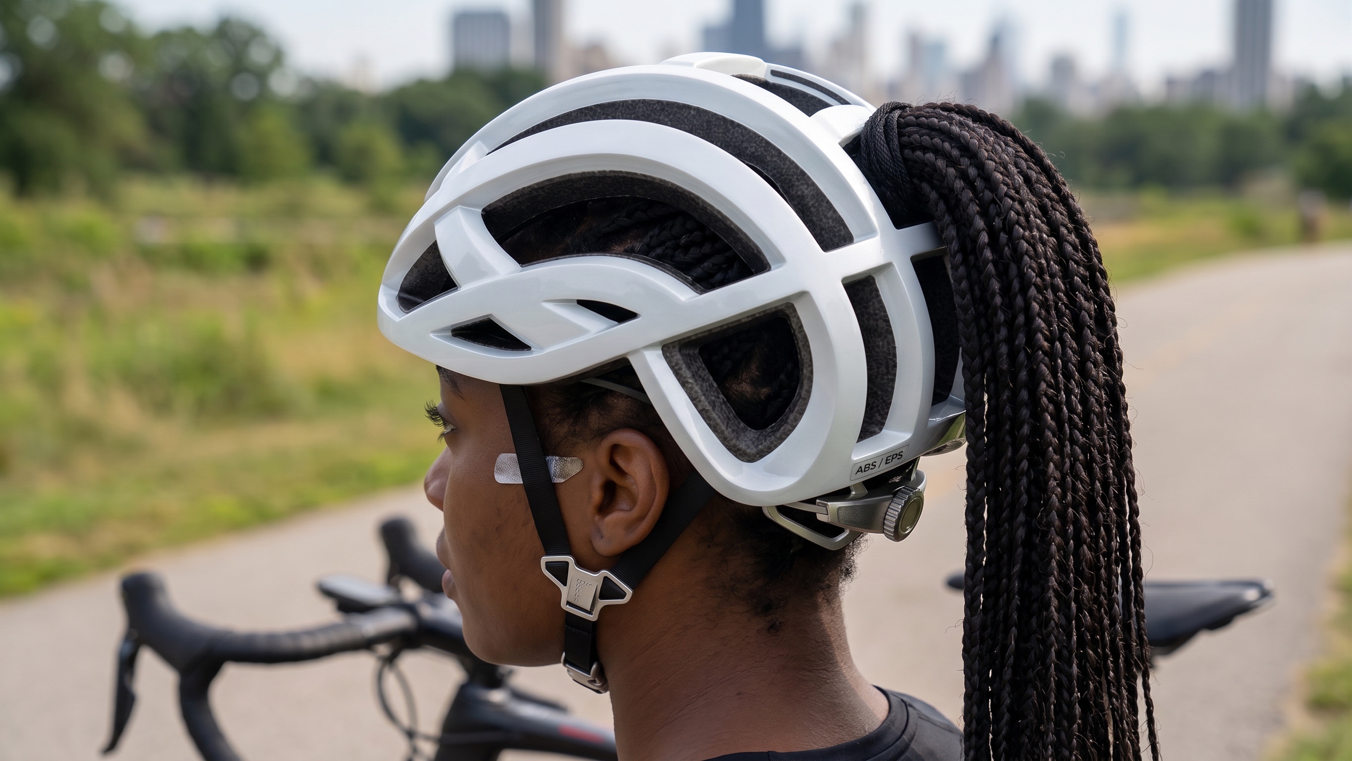 Rider with a braided ponytail wearing the helmet